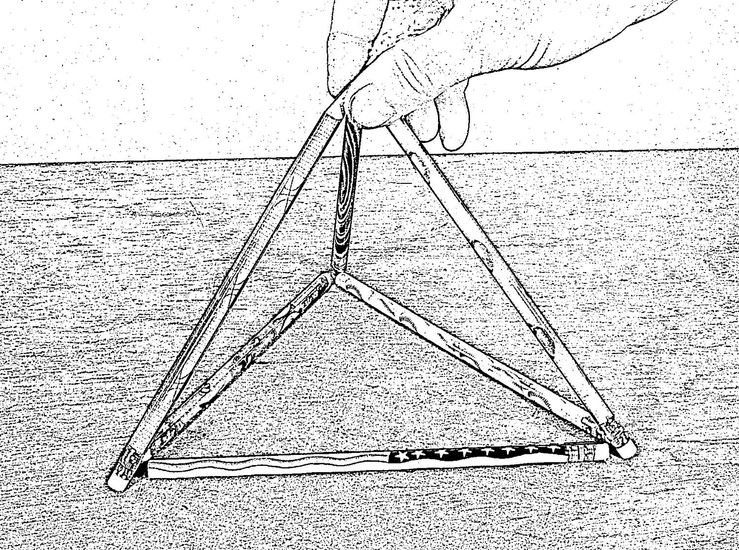 Six matchstick (actually, pencils are a lot easier to hold) can be arranged three-dimensionally to create four triangles.